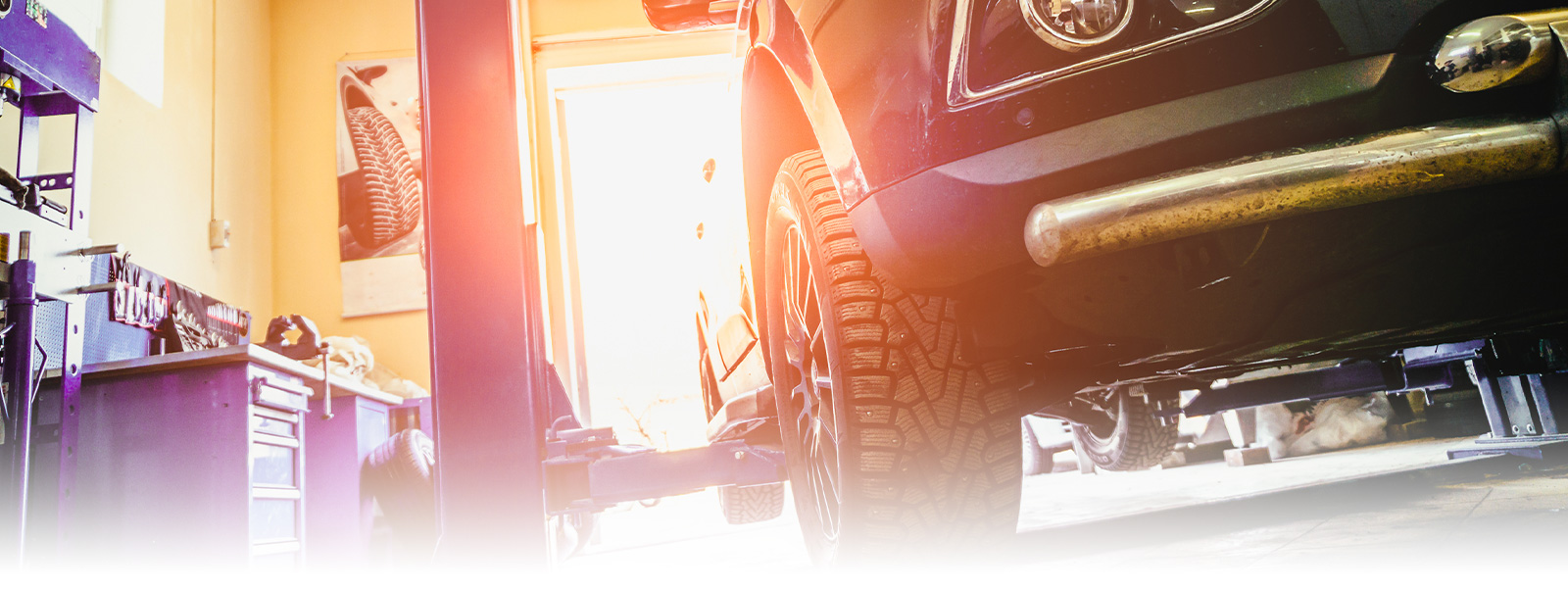 Photo of a car in auto repair shop